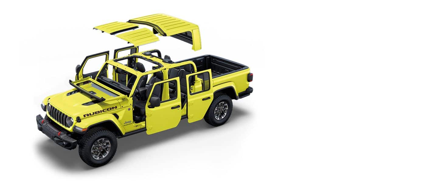 A yellow 2024 Jeep Gladiator Rubicon with the roof and doors detached and the windshield folded.