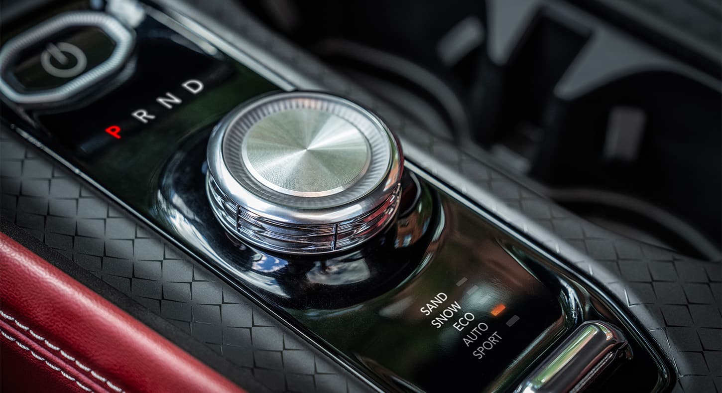A close-up of the Selec-Terrain Traction Management System Drive Mode Selector in the 2024 Jeep Wagoneer S Launch Edition, with Sand, Snow, Eco, Auto and Sport Modes.