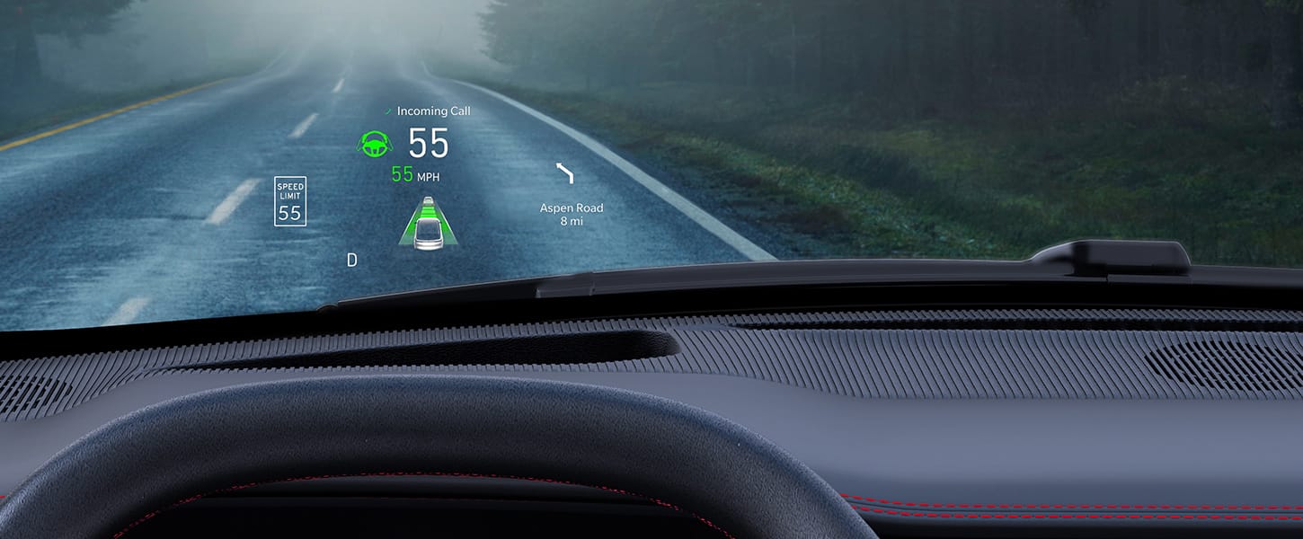 The digital Head-Up Display reflected on the windshield of the 2024 Jeep Wagoneer S Launch Edition displaying in white and green the speed limit, the speed the vehicle is traveling, a navigation direction and notification of an incoming call.